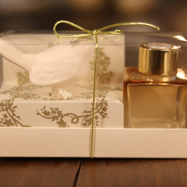 caixa aromatizador com frasco translucido e passarinho